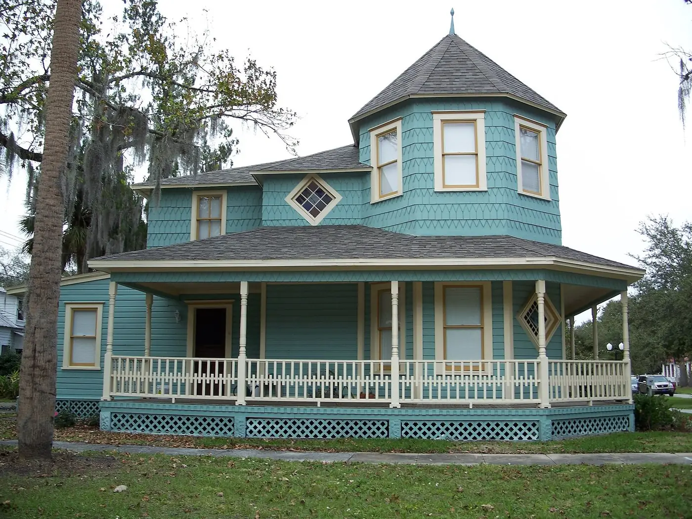 Blue Victorian house with a wraparound porch